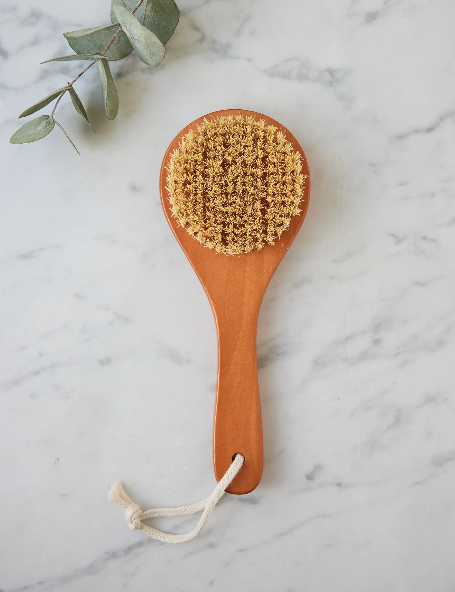 Juniper Loft Soap Company sisal back scrubber on a gray marble countertop