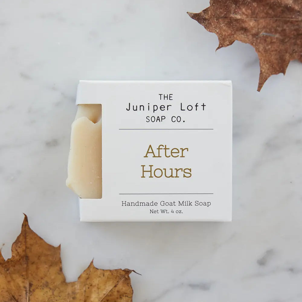 Bar of After Hours soap from Juniper Loft Soap Company next to two large brown fall leaves