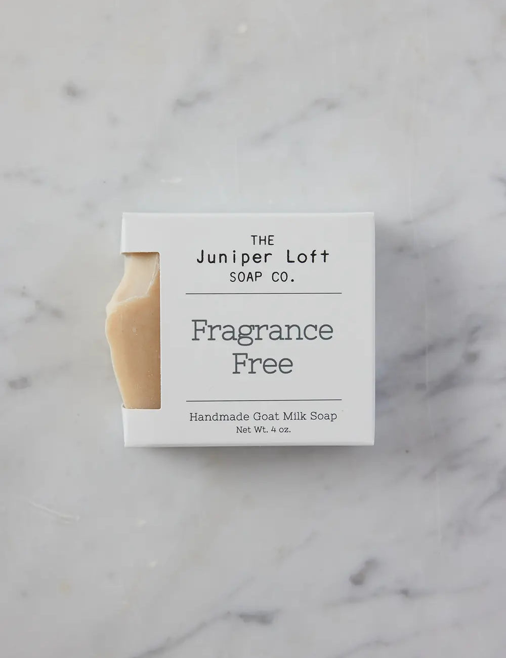 Bar of Fragrance Free soap from Juniper Loft Soap Company on gray marble