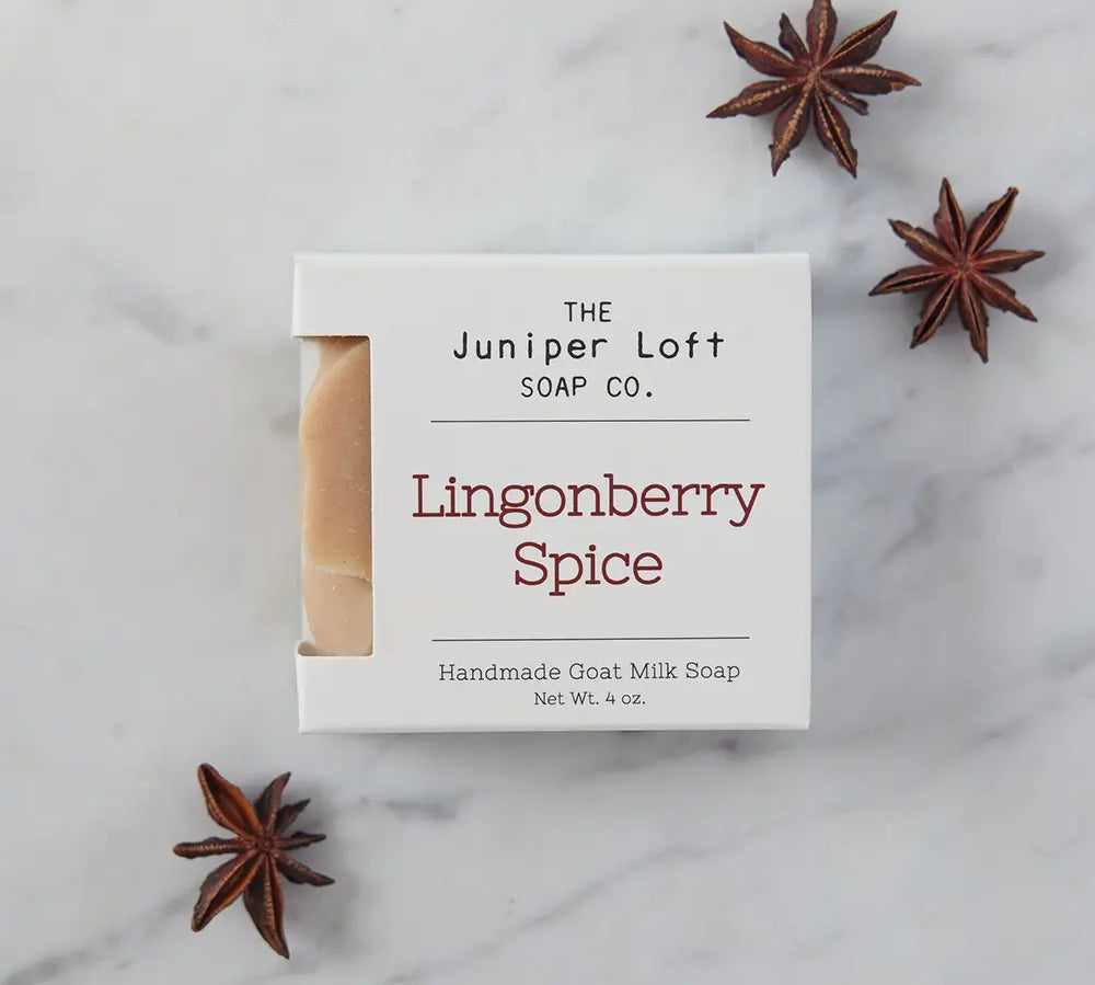 Bar of Lingonberry Spice soap from Juniper Loft Soap Company surrounded by a few star anise