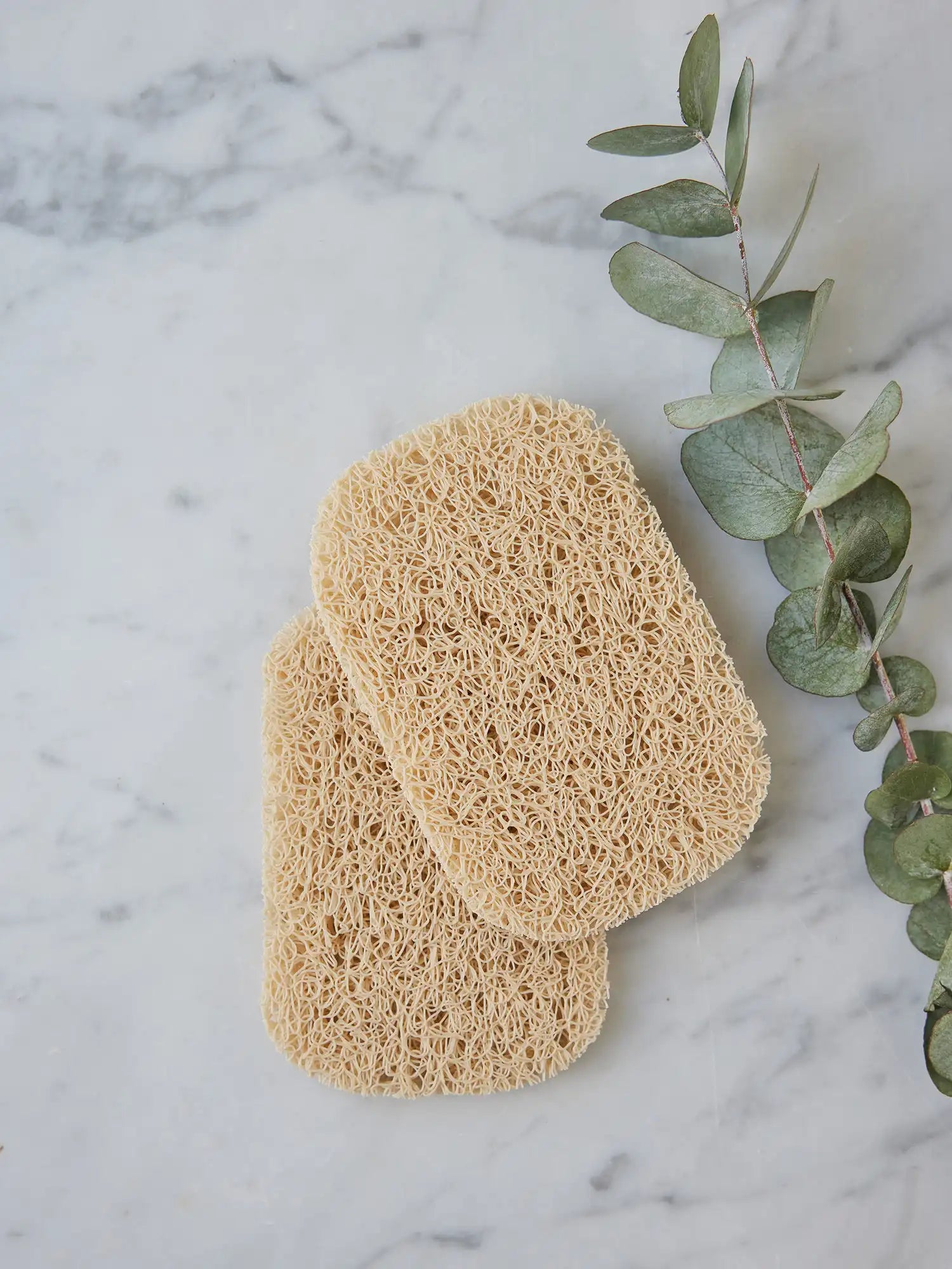 Pair of soap savers from Juniper Loft Soap Company on a gray marble countertop